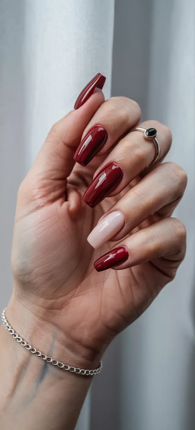 fall winter nails 2025 deep red nude accent