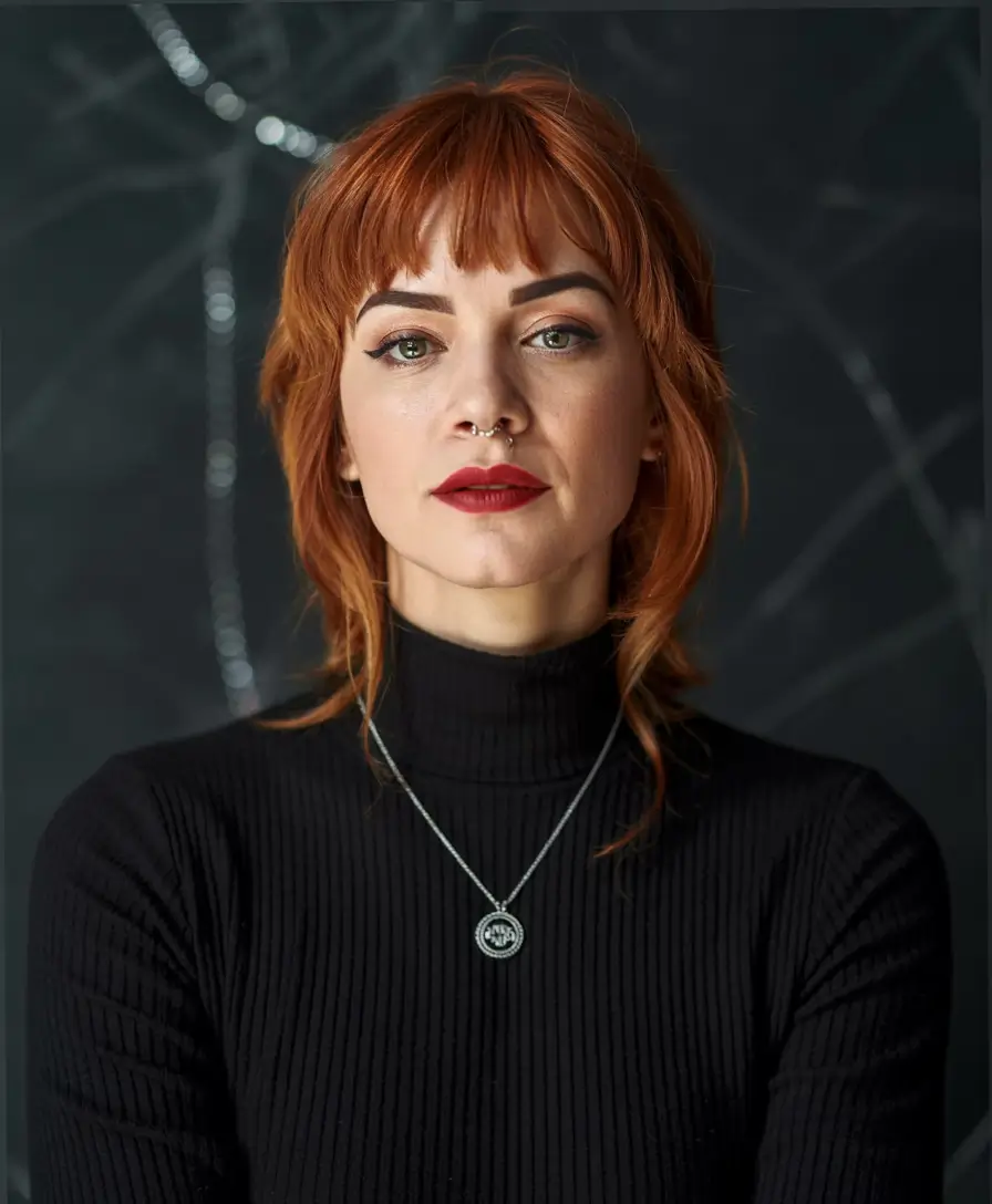 winter haircuts for round faces soft ginger shag with baby bangs