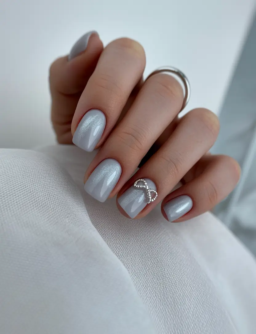 classic square nails 2026 Cool Silver Chrome with a Bow Accent: Modern Bridal Energy