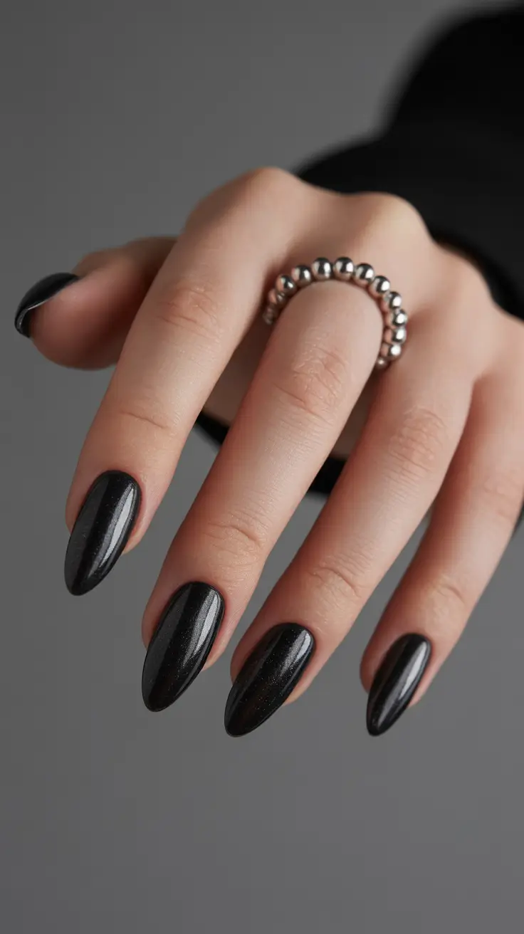 elegant black nails 2026 Night Sky Sparkle on Almond Silhouettes