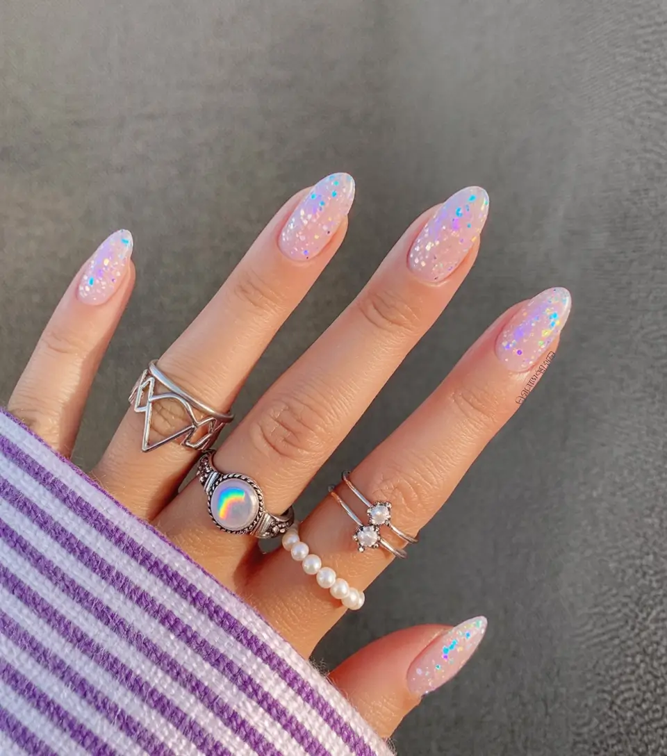 fun birthday nails 2026 Iridescent Glitter Almond Nails for a Soft Sparkle Moment