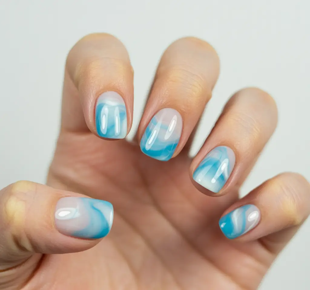 new blue nails ideas 2026 Cloud Soft Pastel Blue Short Swirls