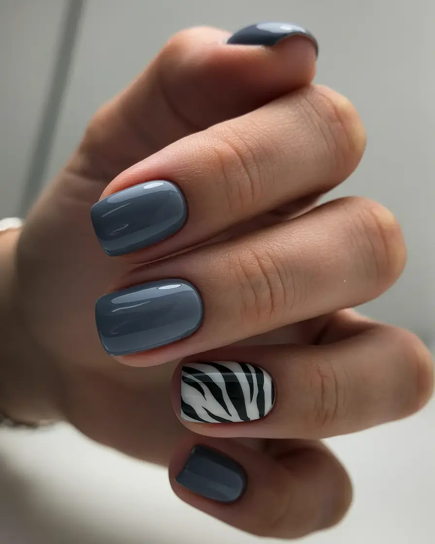 bold colorful spring nails 2026 Slate gray nails with graphic zebra accent
