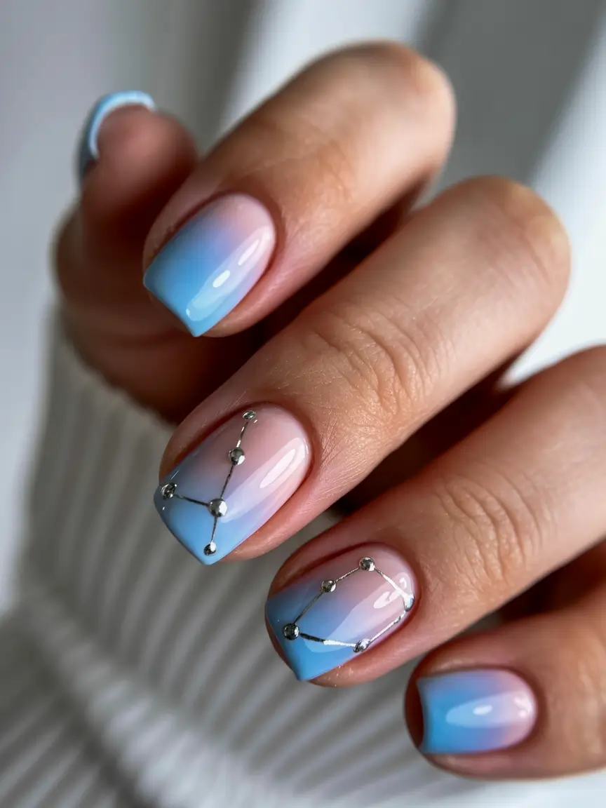 bold colorful spring nails 2026 Soft blue gradient with crystal constellation accents