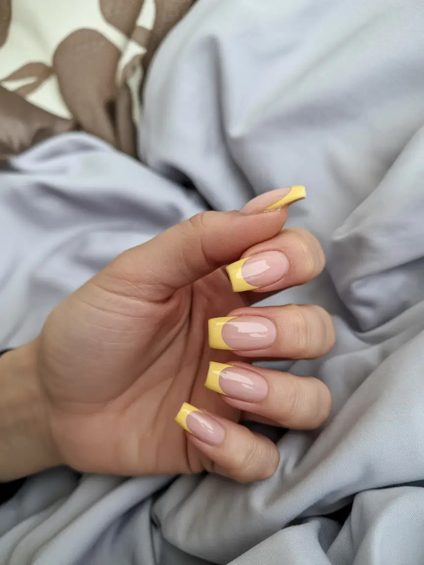 chic subtle spring nails 2026 Soft Yellow French Tip Revival