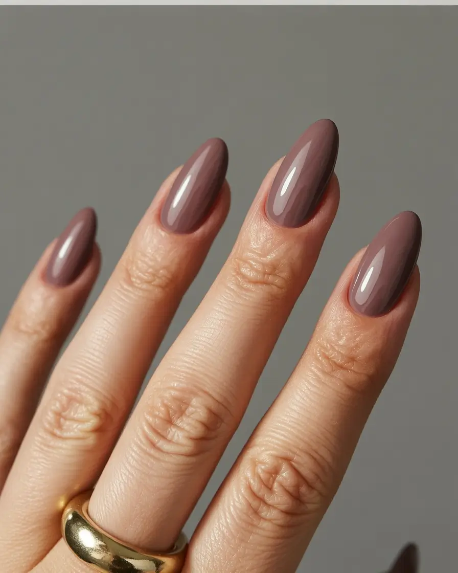 feminine classy spring nails 2026 Glossy Taupe Almond Everyday Luxury