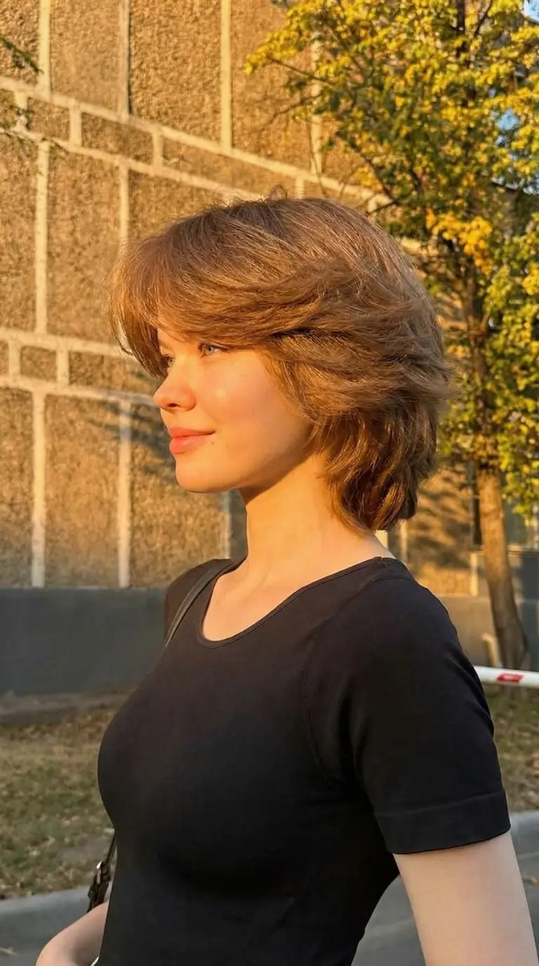 natural spring hairstyles 2026 Feathered Shag Style With Warm Spring Movement