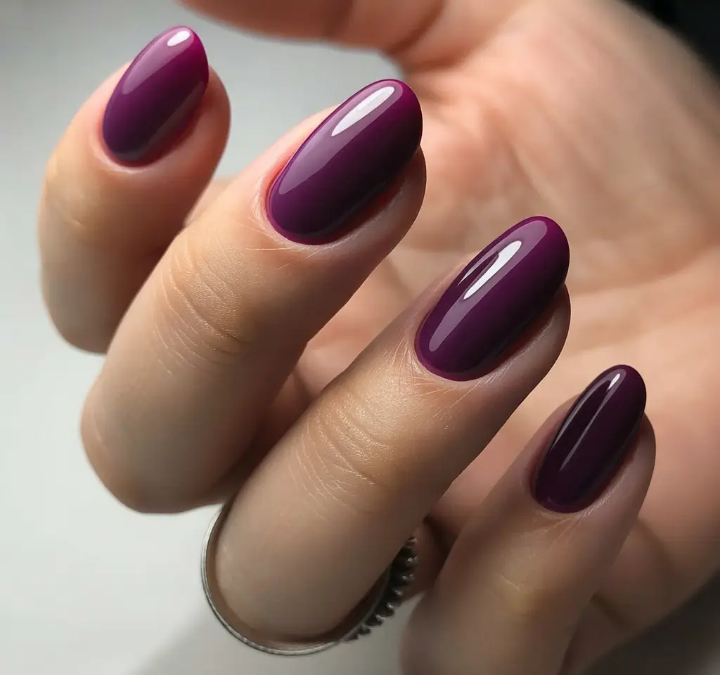 sophisticated bright spring nails 2026 glossy plum almond shape manicure