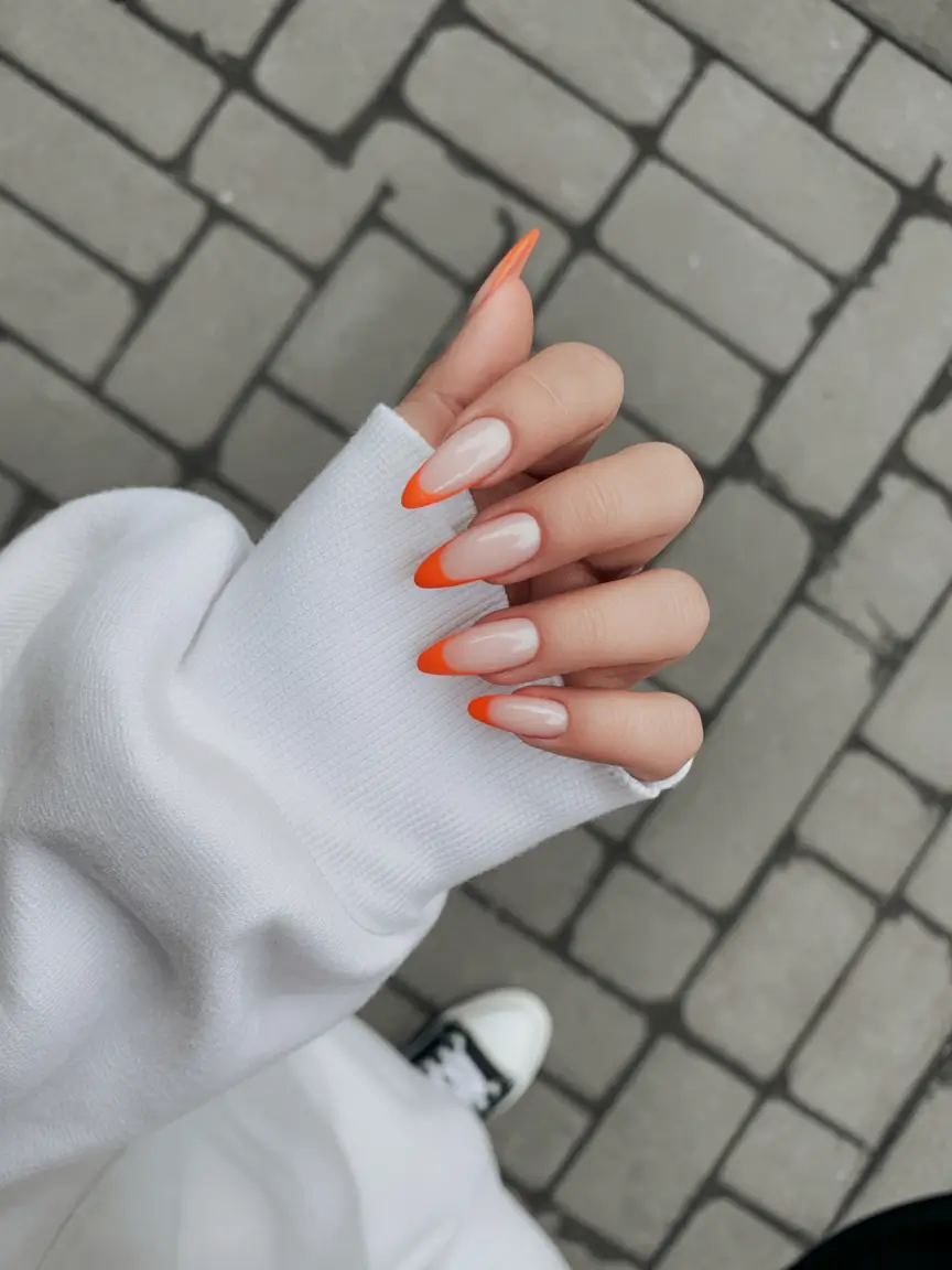 sophisticated spring french tip nails 2026 Vivid Orange Almond French