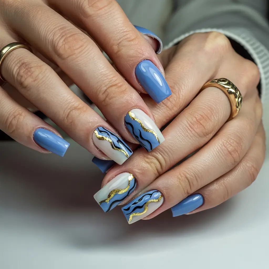 sophisticated trendy spring nails 2026 Blue Waves With Metallic Movement